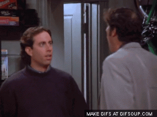 Two Men Standing Next To Each Other GIF