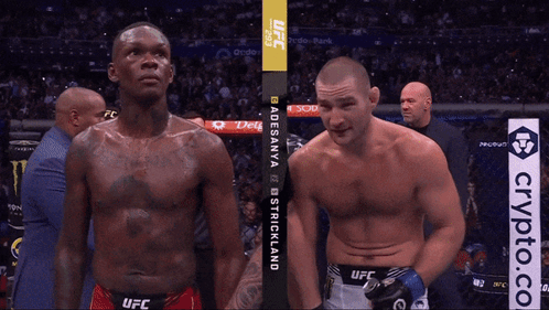 Two Men Standing Next to Each Other UFC Shirts