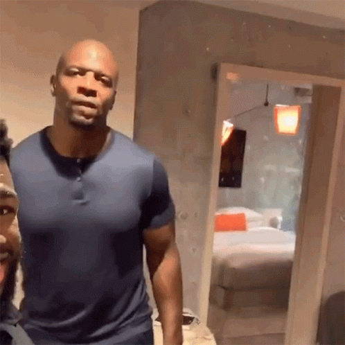 Two Men Standing Next to Each Other