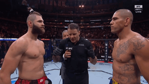 Two Men Standing Next To Each Other With A Man Wearing A Shirt That Says Ufc On It GIF