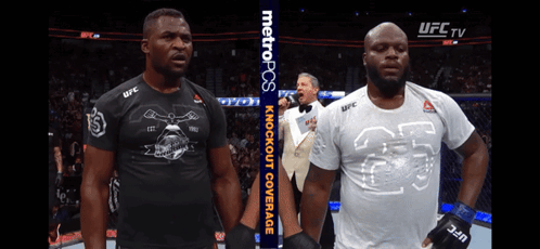 Two Men Standing Next To Each Other With A Metropcs Banner In The Background GIF