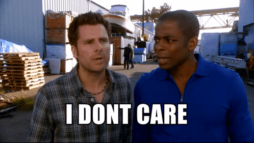 Two Men Standing Next To Each Other With The Words " I Dont Care " On The Bottom Right GIF
