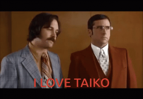 Two Men Standing Next To Each Other With The Words " I Love Taiko " In Red Letters GIF
