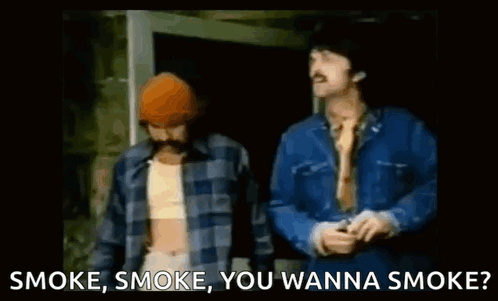 Two Men Standing Next To Each Other With The Words Smoke , Smoke , You Wanna Smoke Written Below Them . GIF
