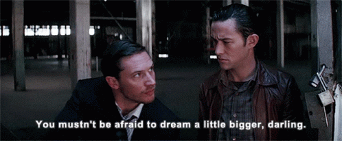 Two Men Standing Next To Each Other With The Words " You Mustn 'T Be Afraid To Dream A Little Bigger Darling " GIF