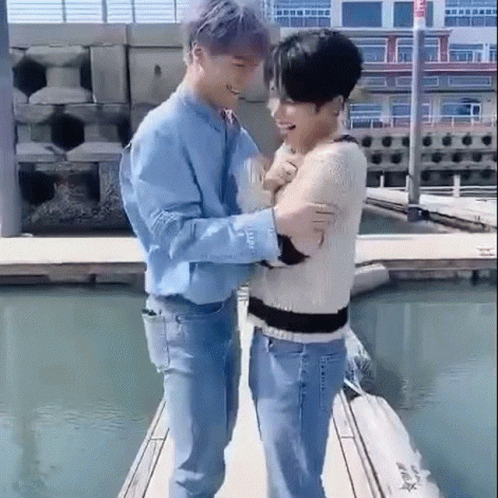 Two Men Standing on a Dock