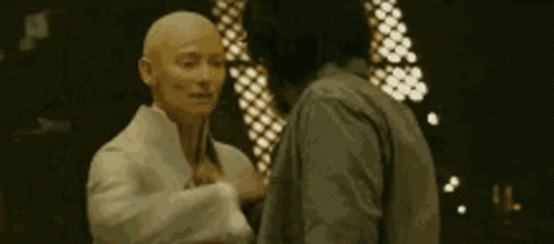 Two Men Standing On Balcony GIF