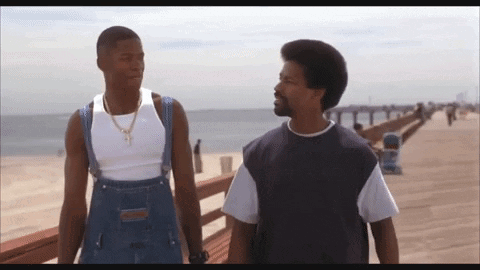 Two Men Standing on Pier Talking