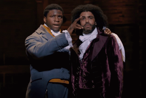 Two Men Standing One In Purple Jacket GIF