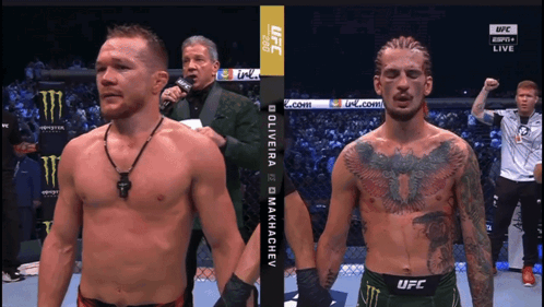 Two Men Standing One in UFC Shirt