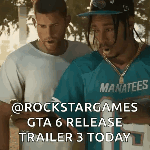 Two Men Standing One Wearing Blue Manatees Shirt GIF