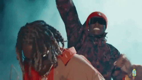 Two Men Standing Together On Stage GIF