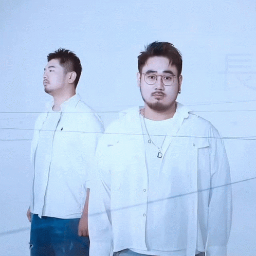 Two Men Standing With Chinese Characters