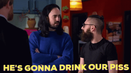 Two Men Standing With He's Gonna Drink Our Piss