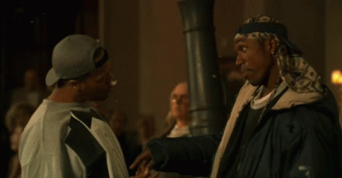 Two Men Standing With Popcorn On Screen GIF