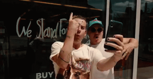 Two Men Taking Selfie at Store Window