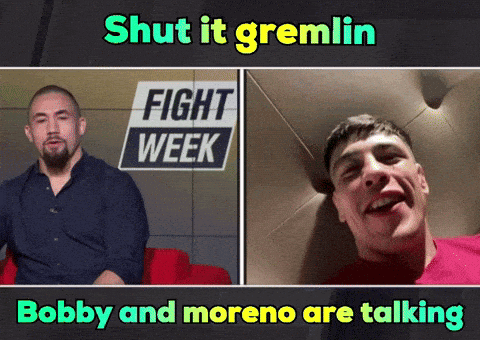 Two Men Talking At Fight Week Sign GIF
