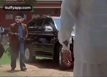 Two Men Talking By Open Trunk GIF