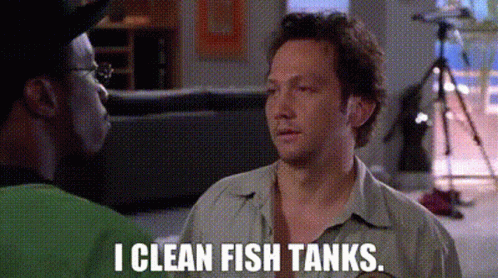 Two Men Talking In Living Room Saying I Clean Fish Tanks GIF