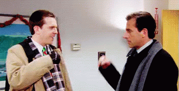 Two Men Talking in Room
