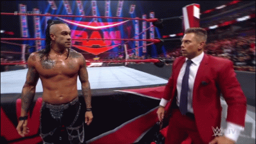 Two Men Talking in Wrestling Ring