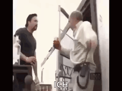 Two Men Talking Next To Truck GIF