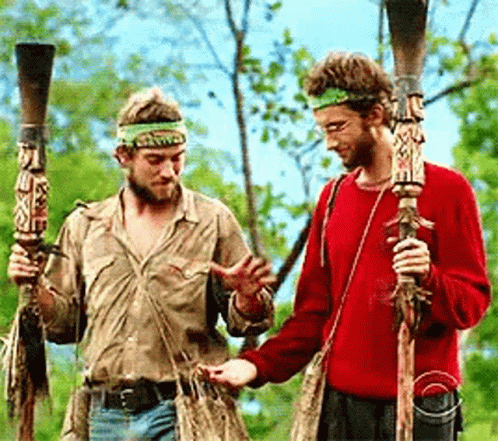 Two Men Talking with Sticks