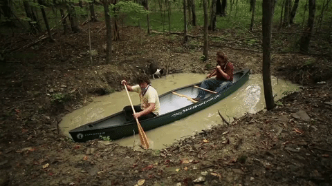 Two Men Try To Row The Boat On Pond GIF