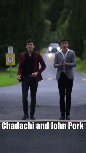 Two Men Walking Down A Road With The Words Chadachi And John Pork Written On The Bottom GIF