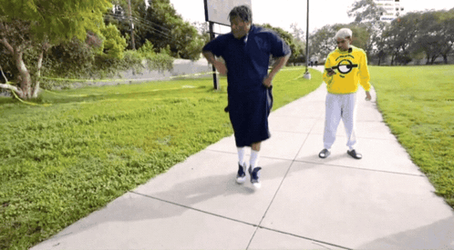Two Men Walking One Wearing Florida Yellow Shirt