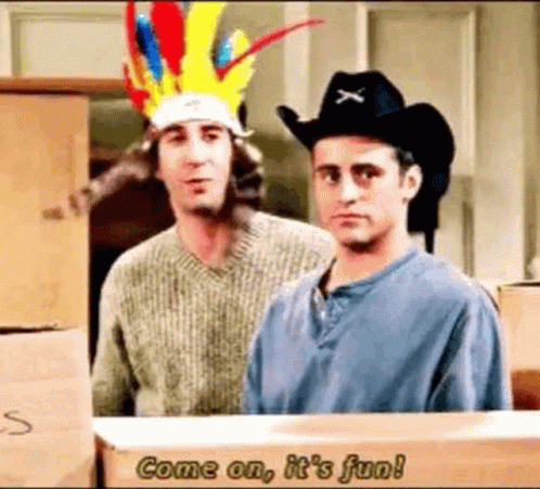 Two Men Wearing Cowboy Hats Are Standing Next To Each Other In Front Of Boxes . GIF