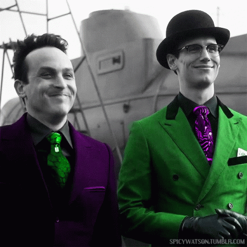 Two Men Wearing Green Suits And Purple Ties Are Standing Next To Each Other With Spicywatson.tumblr.com In The Corner GIF