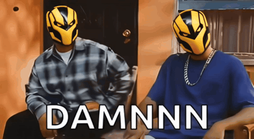 Two Men Wearing Masks Are Sitting Next To Each Other And The Word Damnnn Is On The Bottom GIF