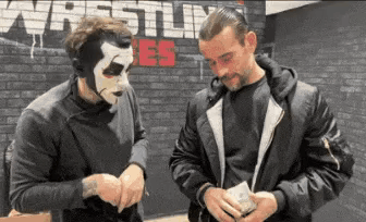 Two Men Wearing Masks Standing