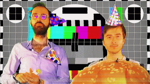 Two Men Wearing Party Hats Are Standing In Front Of A Checkered Screen GIF
