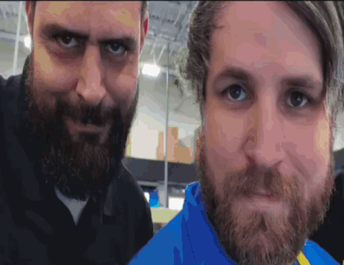 Two Men With Beards Are Posing For A Photo GIF