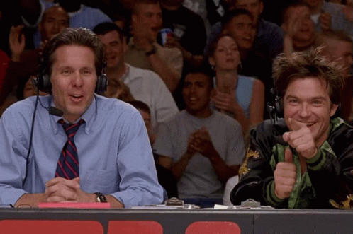 Two Men With Headphones in Front of Crowd