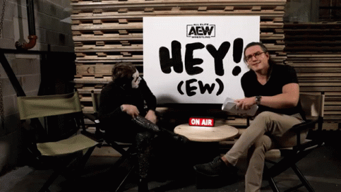 Two Men with Hey Sign