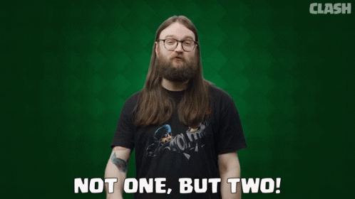 Two Men With Long Hair And Glasses Are Standing Next To Each Other With The Words " Not One But Two " On A Green Backgro GIF