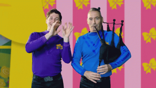 Two Men With Purple Shirt Saying Wiggle