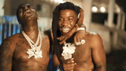 Two Men Without Shirts Are Standing Next To Each Other And Smiling . GIF