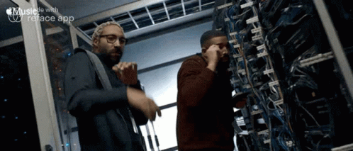 Two Men Working in Server Room