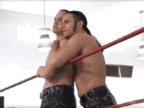 Two Men Wrestling and Hugging