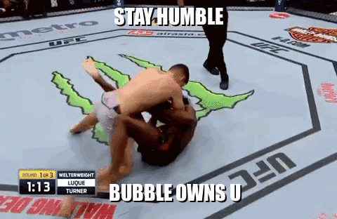 Two Men Wrestling In Boxing Ring Stay Humble Bubble Owns U GIF