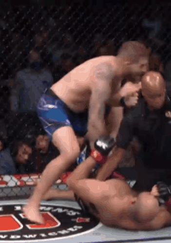 Two Men Wrestling in Boxing Ring