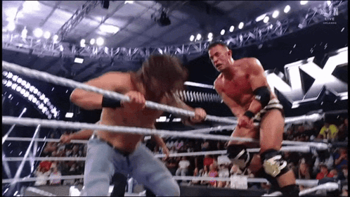 Two Men Wrestling in NX Ring