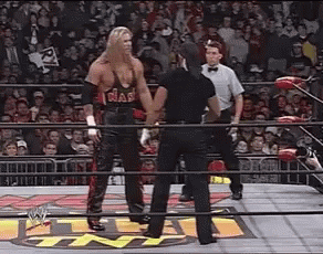 Two Men Wrestling in Ring