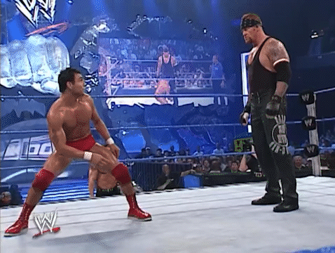 Two Men Wrestling in Ring