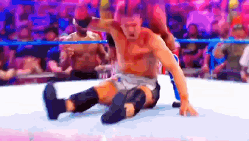 Two Men Wrestling In Ring One On Floor GIF