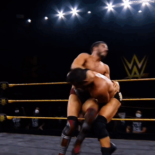 Two Men Wrestling in Ring One on Ground